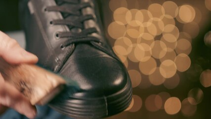 Art of shoe polishing, close up leather care with warm bokeh background, evening footwear maintenance ritual