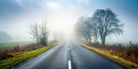 Fototapeta premium Driving on a foggy countryside road with poor visibility , fog, countryside, road, driving, danger, visibility, weather, mist