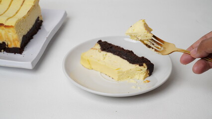 Homemade burnt cheesecake brownies isolated on white background
