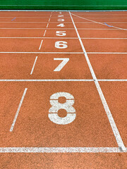 Running tracks and finish line in outdoor sport stadium