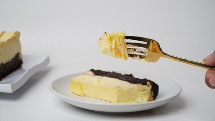 Homemade burnt cheesecake brownies isolated on white background
