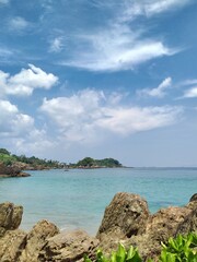 mariana beach with blue sky in indonesia