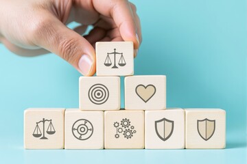 Wooden blocks with justice, target, love, shield, and gears icons arranged as a pyramid, hand placing a block, light blue background, concept of values. Ai generative.
