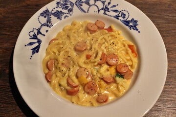 German cuisine: spätzle with cheese sauce and sausages