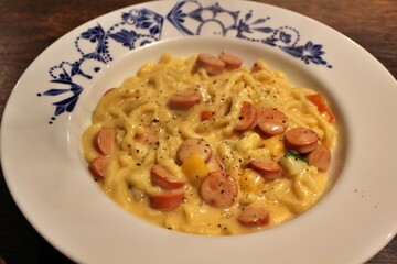 German cuisine: spätzle with cheese sauce and sausages