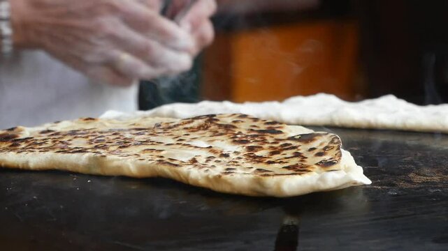 slow motion of Cooking turkish flatbread.