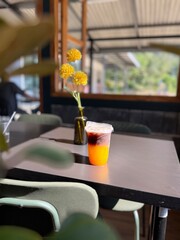 The glass of orange americano coffee