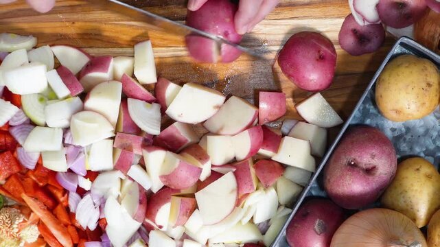 Cooking Corn Chowder for a week night meal. Preparing dinner with lots of ingredients like corn, cream, bacon, potatoes and onions.  Sizzling bacon in a skillet.