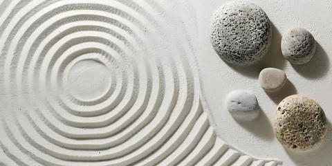 Garden stone with round pattern on white sand background