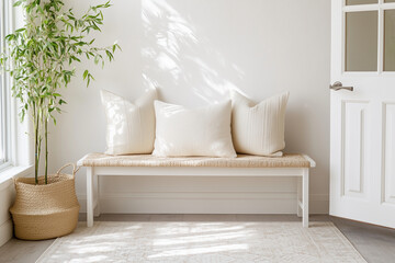 A crisp white-themed Japandi entryway with a white wooden bench, beige cushion, and soft ivory pillows.