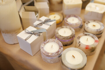 A table with candles and boxes of candles