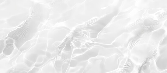 Obraz premium Abstract grayscale image of flowing water with smooth, wavy textures and subtle light reflections.