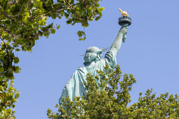 Back view of the Statue of Liberty on the Liberty Island in New York.