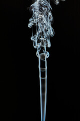 The smoke is thick and dark, creating a mood of mystery and danger