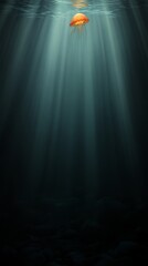 An illuminated orange jellyfish floats gracefully in dark waters, creating a magical underwater scene.