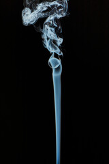 The smoke is thick and dark, creating a mood of mystery and danger