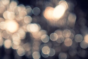 Blurry image of fireworks with a lot of light and dark spots