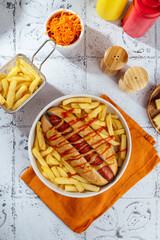 hot dog with fried potatoes