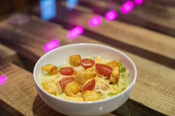 Food in white plate on table. Delicious dish. Hot dinner.