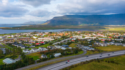 Aerial view of a town with mountain backdrop