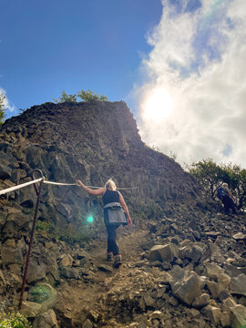 Hiking up a rocky trail on a sunny day