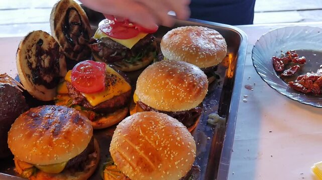 Making burgers and hamburgers outdoor