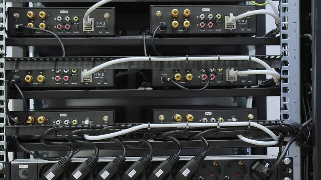 Telecommunication rack with Internet equipment, multimedia amplifiers, video surveillance system. Uninterruptible power supply. Soft focus. 