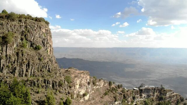 Aerial footage over large rocky mountain and ethipoa landscape 
Aerial footage over Lalibela Mountain, Ethiopia
