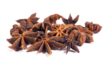 A bunch of dried up  star anise seeds are isolated on white background. Illicium verum (star anise)...