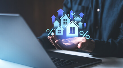 Hand holding house icons with upward arrows and percentage symbols.