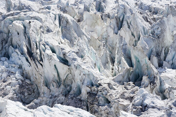 Les Bossons glacier in summer, close shot on the dusty ice (massif du Mont Blanc, France)