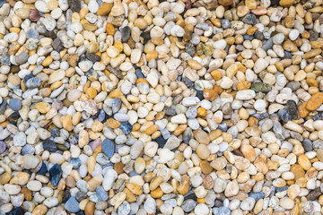 Colorful River Pebbles Background.A Vibrant Collection of Smooth Stones in Various Shades and Sizes