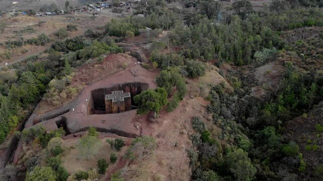 Aerial footage over Saint George Cross shaped rock hewn, Ethiopia
Drone view Saint George Cross shaped rock hewn church, Lalibela, Ethiopia 
