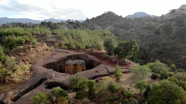 Aerial footage over Saint George Cross shaped rock hewn, Ethiopia
Drone view Saint George Cross shaped rock hewn church, Lalibela, Ethiopia 
