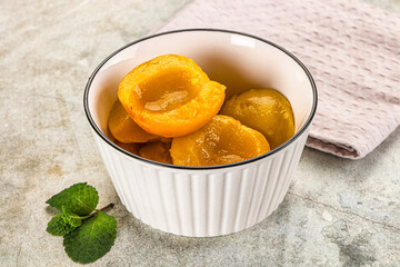Canned marinated peach in syrop
