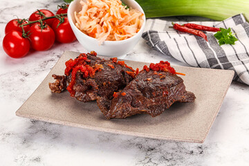 Baked beef cheeks with vegetables
