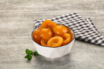 Sweet canned apricots with syrope