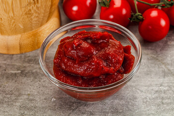 Red tomato paste in the bowl