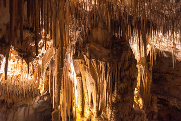 Stalactites and stalagmites creating evocative shapes in the caves of drach