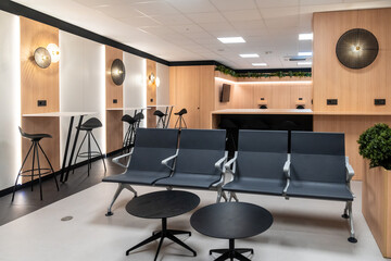 Modern airport lounge offering comfortable seating and workspace