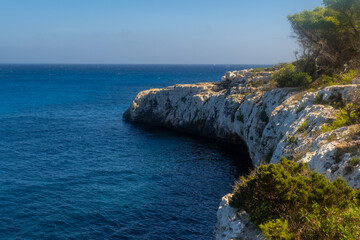 White cliffs meeting the deep blue sea in cala mondrago, mallorca
