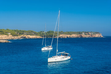 Sailboats anchoring near cala mondrago beach in mallorca, spain