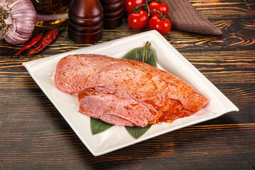 Raw marinated duck breast for cooking