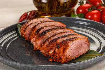 Sliced duck breast baked with cherry