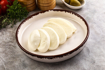 Organic mozzarella cheese slices in the plate