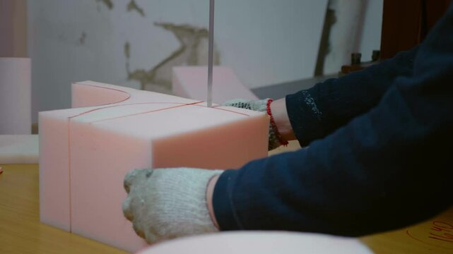 Cuts out details from foam rubber for upholstering furniture.