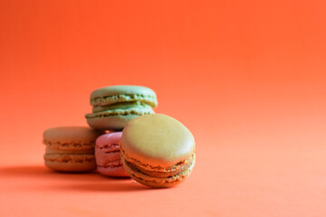 French sweet and assortment of macarons, varied and colored. Close up and copy space.