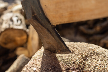 Close-Up of an Axe Cutting Through WoodClose-Up of an Axe Cutting Through Wood