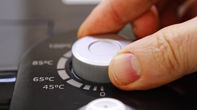 Power button and temperature control on the thermopot. household appliance for water heating. Tea and coffee making service. hot water dispenser.