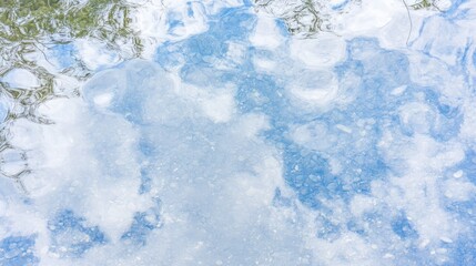 Fototapeta premium Sky Reflection in Clear Shallow Water with Pebbles